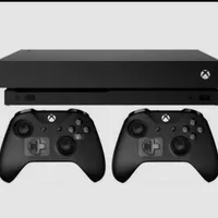 کنسول xbox one x دو دسته،پایه شارژ و بازی های روز