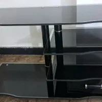 میز تلویزیون کشو دار شیشه ای شفاف اینه