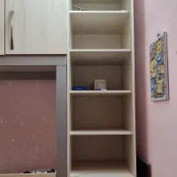 تخت دو طبقه بهمراه میز تحریر و قفسه و کمد