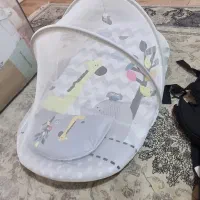 آغوشی و پشه بند نوزاد