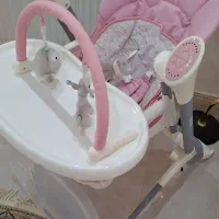 صندلی چندکاره گهواره و غذاخوری موزیکال