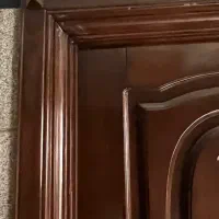 درب چوبی با چارچوب و روکشی چوبی و دستگیره اعلا