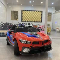 ماشین شارژی BMW دو سر نشین دو کودک۷سال