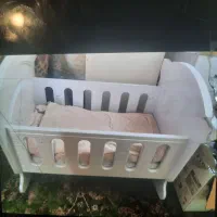گهواره کنار تخت مادر