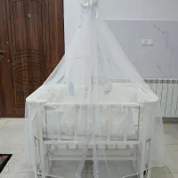 تخت نوزاد گهوارهای موزیکال