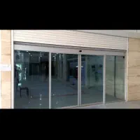 طراحی و نصب شیشه سکوریت و درب کرکره ای