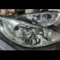 چراغ ۲۰۶  ایساکویی اصلی جلوتمیزشفاف همراه باموتور