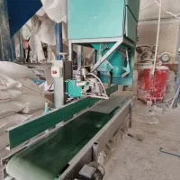 دستگاه گونی گیر به همراه نوار نقاله و پایه دوخت