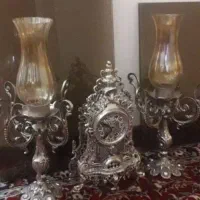 ساعت و شمعدان برنزی