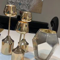 گلدان مدرن طلایی و شمعدان سه تایی طلایی