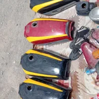 لوازم موتور هندا 125 باک زین اگزوز کمک عقب و..