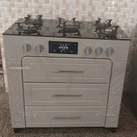 اجاق گاز طرح فر جنس ام دی اف صفحه شیشه ای سه کشو