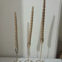 شمعدان و شمع طلایی