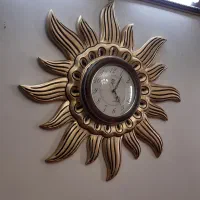 ساعت با طرح خورشیدی ابعاد ۷۰ در ۷۰ رنگ طلایی مشکی