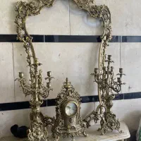 فروشنده و‌ خریدار اینه شمعدان برنزی قدیمی