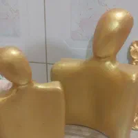 مجسمه زوج و قاب اینه