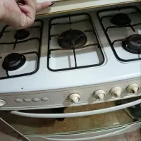 اجاق گاز ۵ شعله فر دار دوجوجه گردان سالم و تمیز