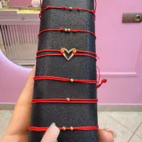 دستبند رد استرینگ و هفت گره
