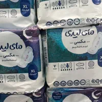 تعدادی پوشک تو سایز ببندی و نوار بهداشتی
