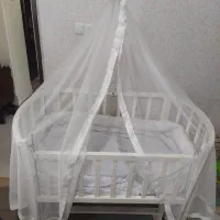 تخت گهواره کنار مادر