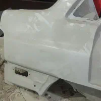 لوازم استوک بدنه در عقب جلو سمند سفید سمت راننده