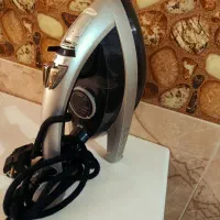 اتو و روروغک واتوی مو وکاپ کیک و مقداری وسایل خانه