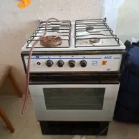 اجاق گاز چهار شعله فردار آردل. میز. صندلی. جاکفشی