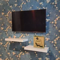 نصاب شلف میز زیر تلویزیون پایه براکت tv دیواری پشت