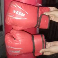 دستکش بوکس RDX و کیسه بوکس Top King و کتونی