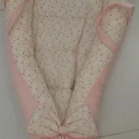 قنداق فرنگی یا تشک گارد دار یا ساک حمل نوزاد