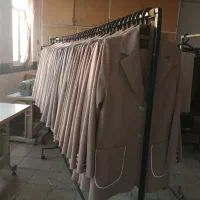خیاط مانتو. اتوکار وردست