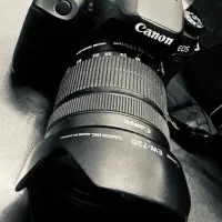 دوربین Canon 77D با لنز 18/135 با کارتون