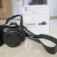 دوربین دیجیتال Canon PowerShot SX1 ISباجعبه و پایه