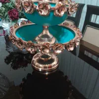 میوه خوری جنس پایه و گل های دورش از مس هست