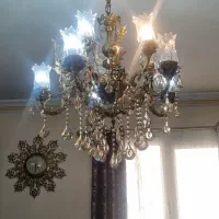 فروش لوستر با ساعت وشمعدون وشکلات خوری