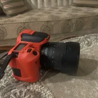 دوربین کنون 77دی با سه پایه