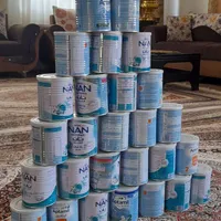 تعدای قوطی شیر خشک