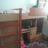 تخت دو طبقه همراه با میز و کمد
