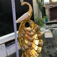 مجسمه طاووس دومیلیون تومان