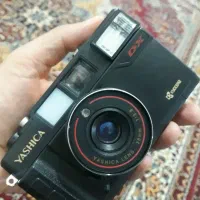 دوربین عکاسی یاشیکا و سه‌پایه دوربین عکاسی