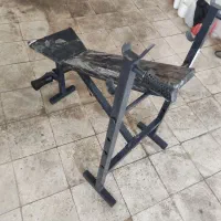 میز پرس سینه همراه با یک هالتر