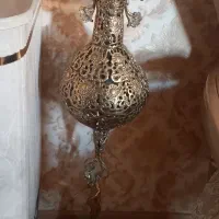 گلدان برنزی همراه گل های مسی
