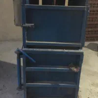 یک‌عدد دستگاه پرس و شریدر خرد کن کاغذ پوشال
