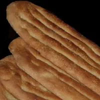 نیازمند شاطر با خمیرگیر‌ بربری