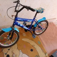 دوچرخه سایز ۱۶ رنگ آبی سالم درحدنو لاستیک ها نو