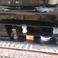 میز شیشه ای و تلوزیون ال جی
