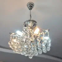 ۲عدد لوستر کریستال برند مهرافروز و یک دیوارکوب