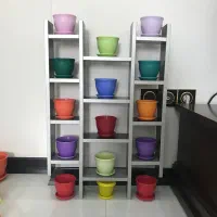 استند به همراه گلدانهای رنگارنگ زیبا