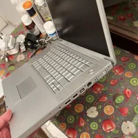 لپ تاپ مک بوک پرو قدیمی همراه هدست اورجینال