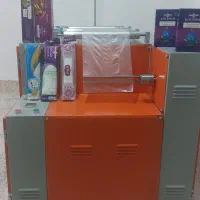 دستگاه سه کاره رول به رول سفره یکبار مصرف در حد نو